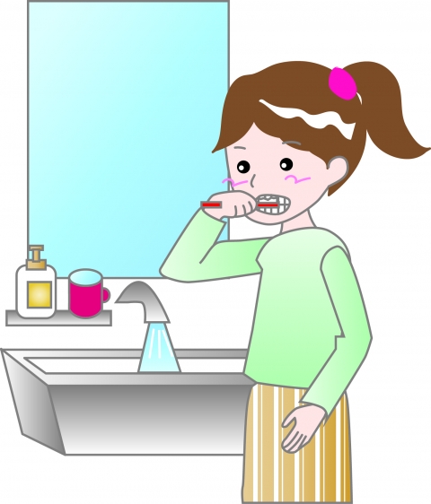 歯を磨いて立っている女性のイラスト