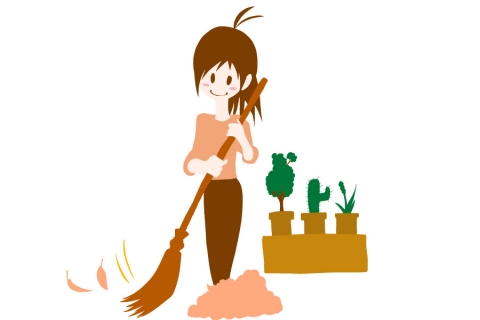 落ち葉をほうきで掃いている女性のイラスト