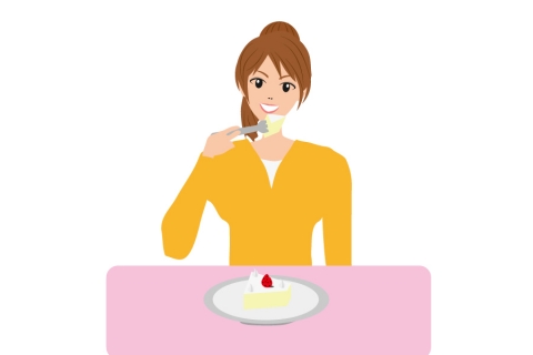 ケーキを笑顔で食べている女性のイラスト