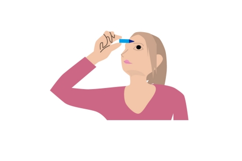 目薬をつけている女性のイラスト